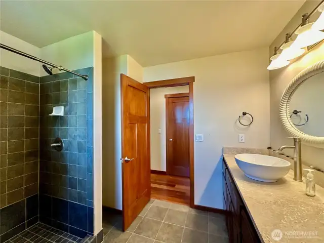 A separate suite/4th bedroom with a large living space, sleeping quarters and ¾ bathroom.