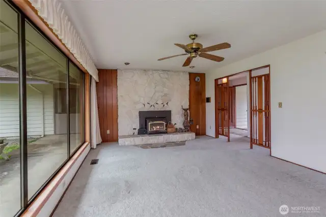 Another view of living room with wood screen entry accents