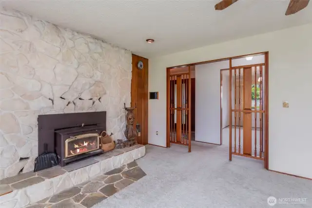 Another view looking from living room into entry and dining room