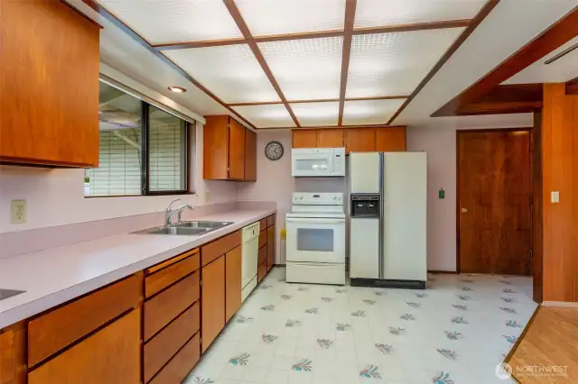 Kitchen with cheerful pink countertops