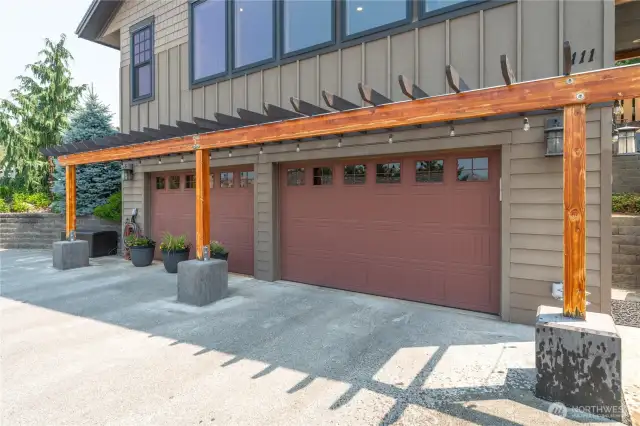 Attached two-car garage with the left bay converted into a spacious bonus room—perfect for entertaining or hosting guests.