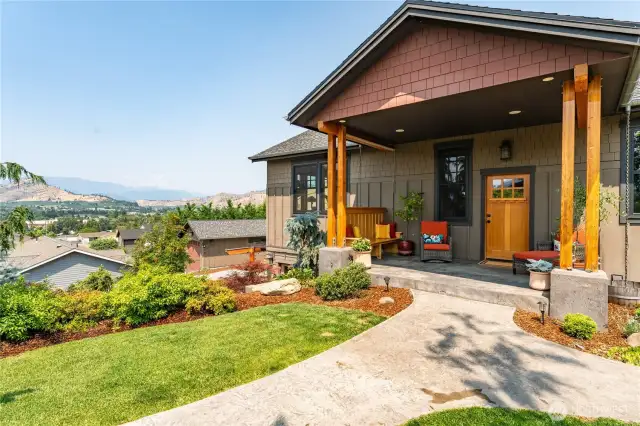 Expansive front porch with a built-in bench—perfect for relaxing and taking in the peaceful surroundings.