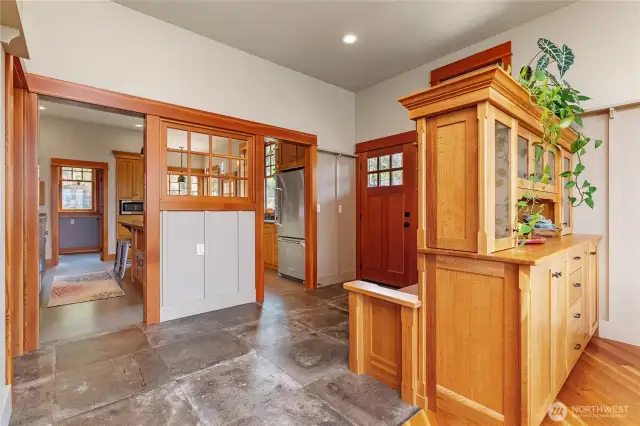 Main floor entrance offers a smooth, open flow between the kitchen and living area—ideal for everyday living and entertaining.