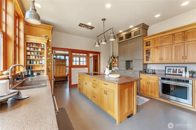 The kitchen is exceptionally spacious—offering room to cook, gather, and even dance.
