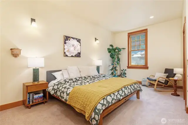 Expansive primary suite featuring custom built-ins and a spacious walk-in closet for refined comfort and organization.
