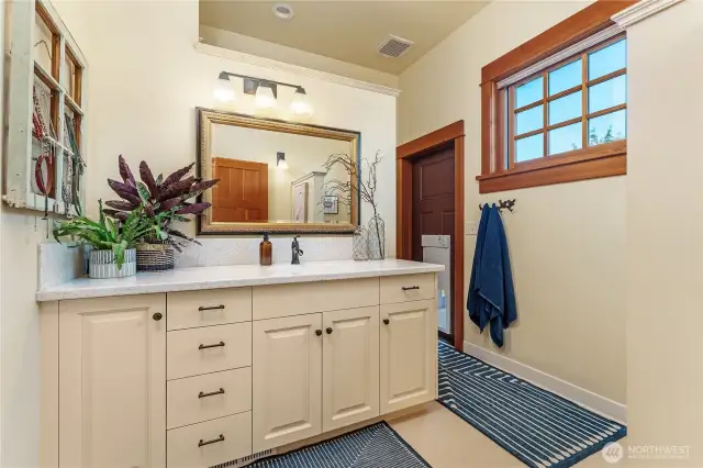 Primary bathroom includes direct access to the backyard hot tub area—seamlessly blending indoor luxury with outdoor relaxation.