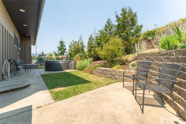 Cozy side yard offers potential for a dog run or a private outdoor spa retreat.