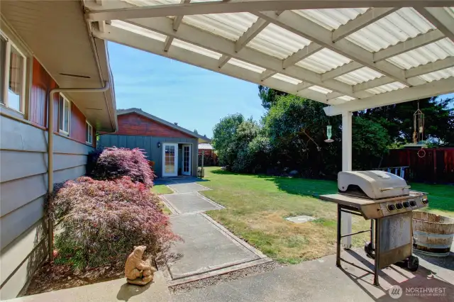 Covered patio in backyard.