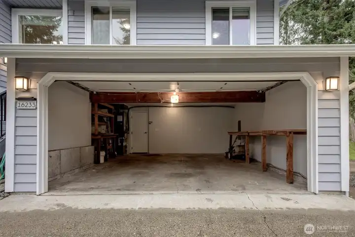 Garage finished and painted w/ new electrical panel, work benches and wired for EV charger,