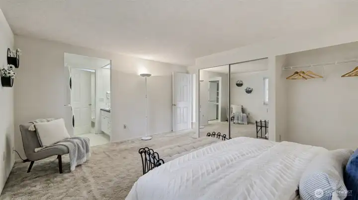Generous primary bedroom with ample closet space and ensuite access