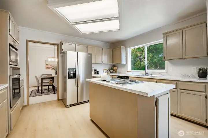 Kitchen with fresh paint, new flooring and countertops