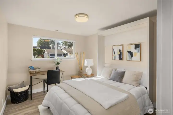 Built-in Murphy bed folds up easily to create flexible space and stays with the home.