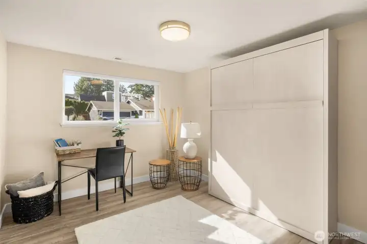 Built-in Murphy bed folds up easily to create flexible space and stays with the home.