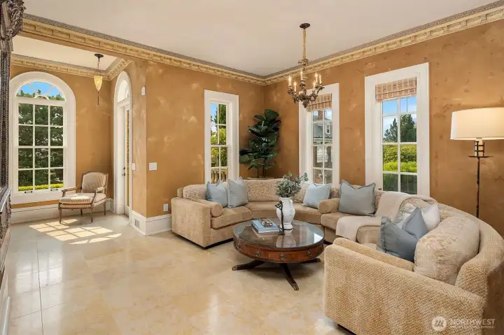 Sitting room or music room adjacent to living room. Fortuny ceiling lamps and antique fixtures glimmer throughout home.