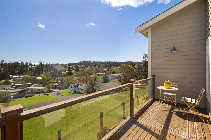 Elevated deck provides stunning panoramic views of Friday Harbor's tree-lined neighborhoods and open green spaces facing south for year round natural light.