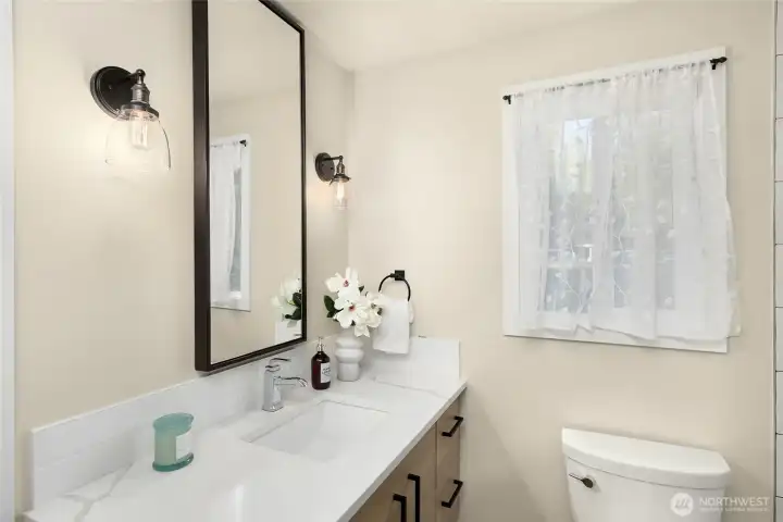 Adjacent 3/4 bath offers stylish finishes