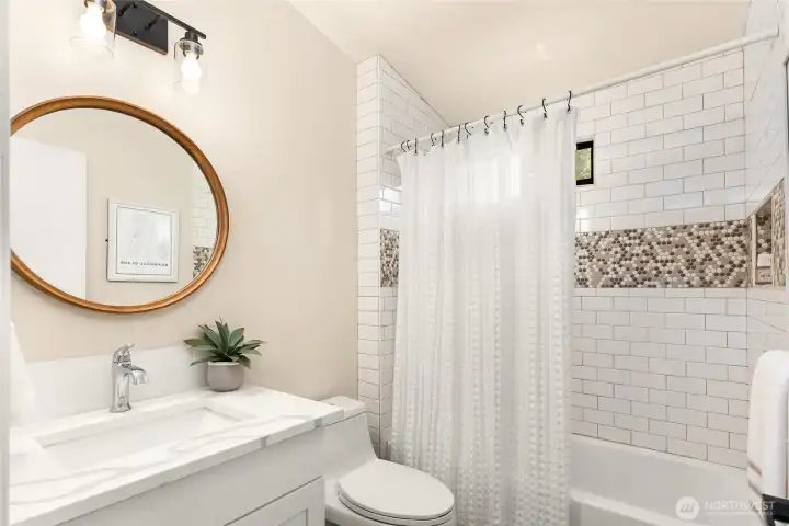 The upstairs bedrooms share a full bath showcasing the same quality finishes