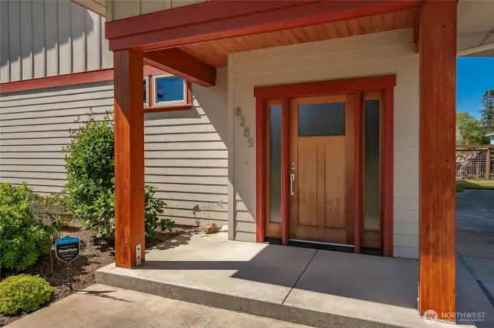 Nine inch beams are a signature in this property. Highlighted at the front entry, deck and downstairs areas.