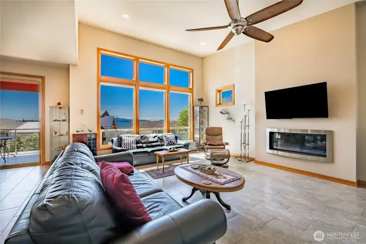 Great room with vaulted ceilings, gas fireplace, tile floors, heat pump and fan. Tremendous light with Hemlock wrapped windows and southern exposure.