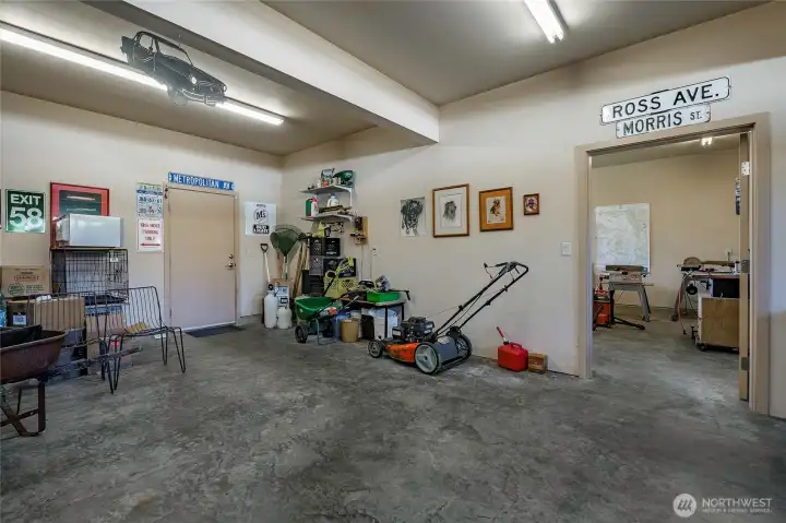 1335 square foot garage / shop area. This is the 3 car portion. The shop entry has a special 42 inch door for convenience. High ceilings' in place for both.
