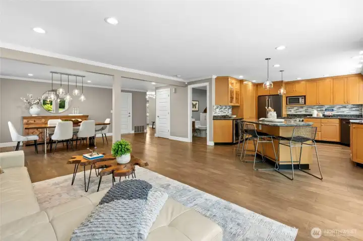 Daily life naturally centers around these open living spaces, where the kitchen, dining, and gathering areas stay connected without feeling crowded.  The layout makes it easy to stay part of the conversation whether preparing meals, hosting friends, or simply settling in for a quiet evening at home.