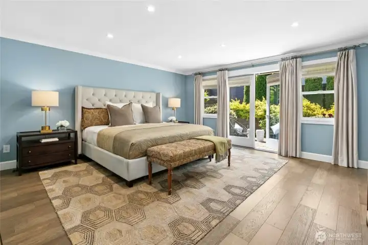 The oversized primary suite offers a peaceful retreat with soft natural light and direct access to the backyard patio, where the nearby hot tub creates the perfect setting to unwind at the end of the day.