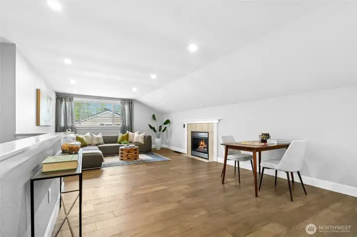 The upper level bonus room offers a flexible retreat space with expansive floor area and a cozy gas fireplace that adds warmth and comfort.  Perfect for movie nights, games, a media room, or quiet workspace, the layout easily adapts to a variety of needs.