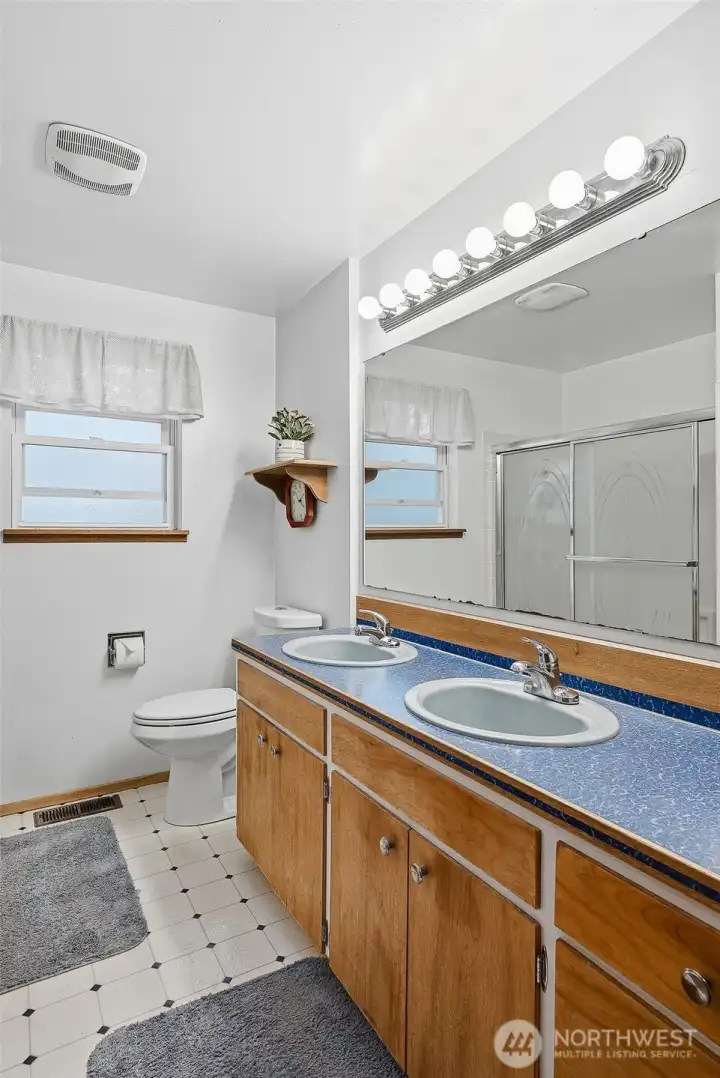 Full bath with double vanity and tons of storage