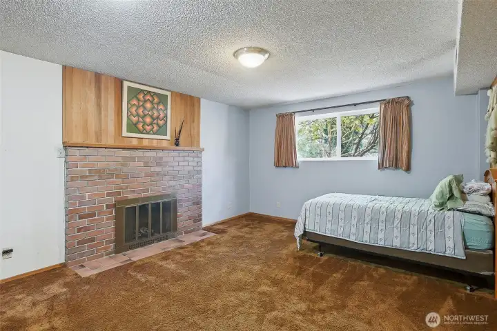 Family room with fireplace, looking towards front of home