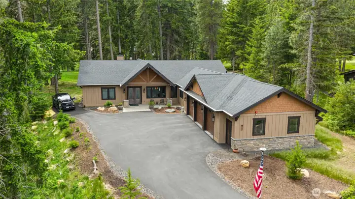 Bonus parking off side of home, great for trailer or guests. Aerial view of home