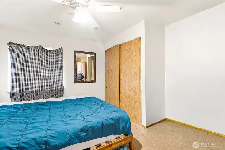 Main bedroom in Unit B. Photo has been de-staged for tenant privacy