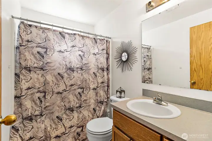 Attached bath in Unit B is good sized. Photo has been de-staged for tenant privacy