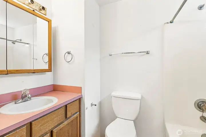 Second full bath in Unit B. Photo has been de-staged for tenant privacy