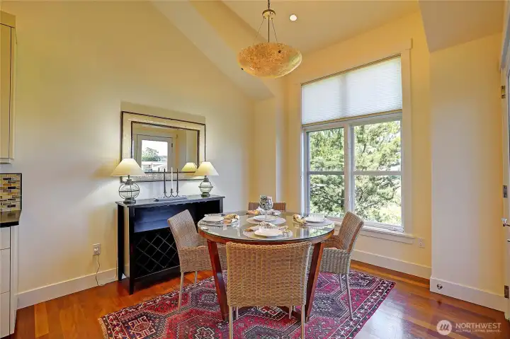 Dining room w/ balcony access to the right.