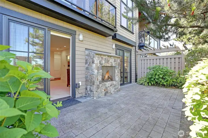 Private patio with outdoor gas fireplace.
