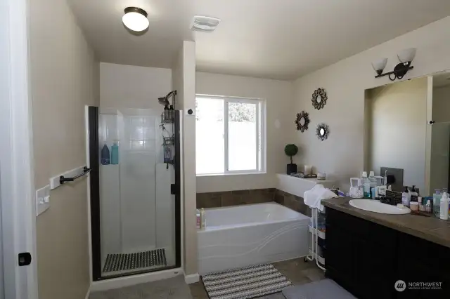 Primary bath off bedroom with separate shower and tub.