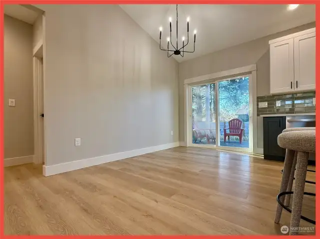 Dining area with door leading to the back deck