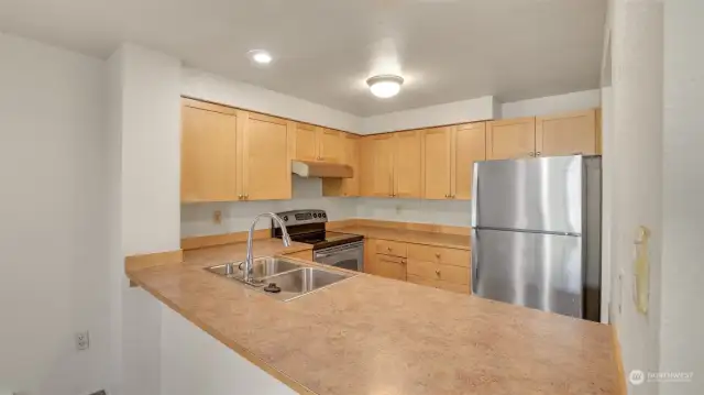 Great sized kitchen with ample counter space and stainless steel appliances.