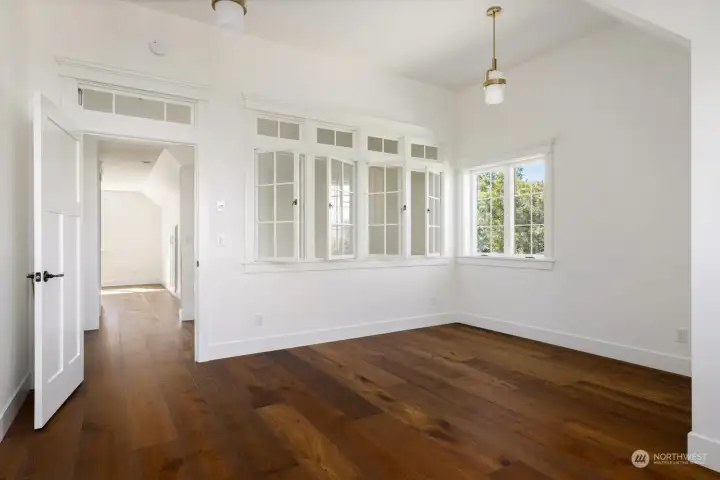 Office with amazing interior windows for light and heat thru transom.