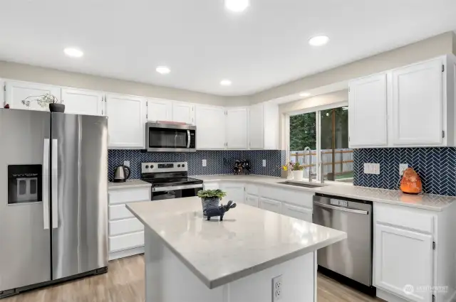 Updated Kitchen with stainless steel appliances and quartz countertops