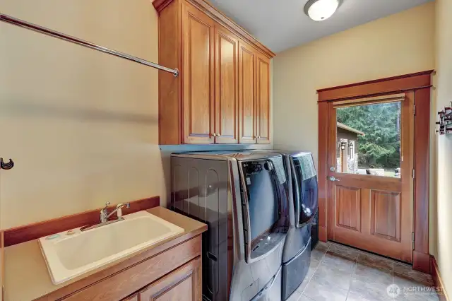 Laundry room with exit to outdoors.