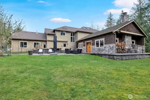 Spacious peaceful back yard and outdoor living space with hot tub for entertaining.