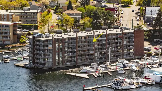 Framed by water and sky, this elevated southwest-facing unit claims a premier position at Spinnaker Bay—perfectly placed for panoramic views and endless light.