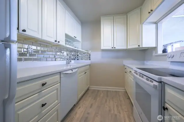 Bright, clean, and thoughtfully appointed—this kitchen balances classic design with effortless flow, perfect for morning routines, shared meals, or a quiet evening unwind.