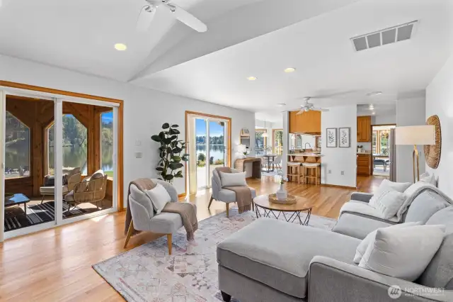 Family room connected to the kitchen and opening up to both the deck and the huge screened in porch/pergola.