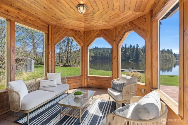 This lovely screened in porch is the perfect place to enjoy your morning cup of coffee.