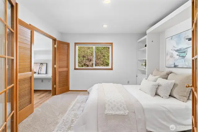 Main floor den/office with a murphy bed and walk in closet that has been converted to an office space.  Great opportunity for a main floor primary suite.