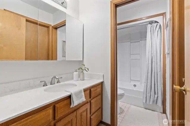 Primary bath with private tub/toilet.