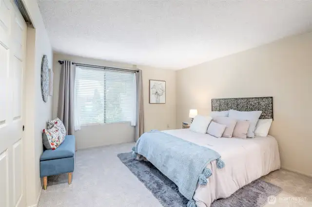 Primary bedroom provides a view to the back yard area.You'll love the fresh new carpet throughout this home.