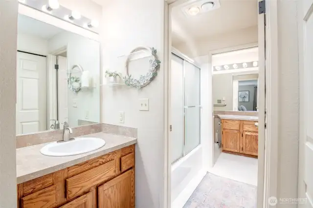 Primary bedroom has a private sink/vanity and access to the full bathroom.